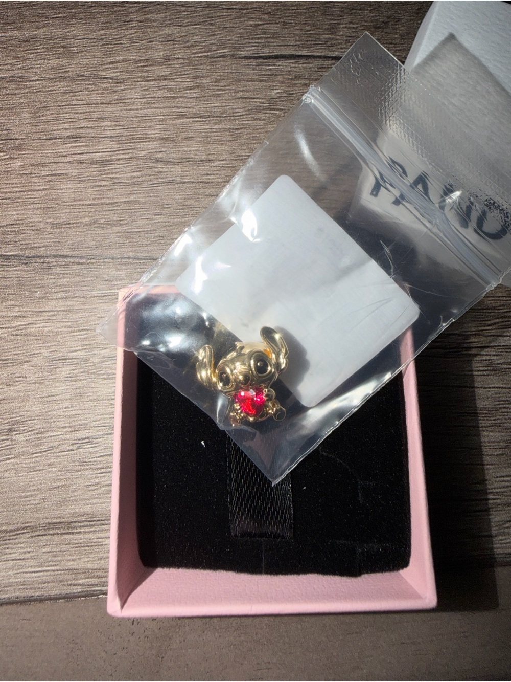 Pandora Gold Tone Character Stitch with Red Crystal Heart